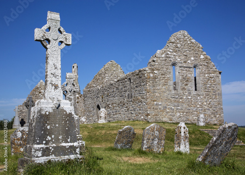 Clonmacnoise Cathedral  with the typical crosses and graves photo