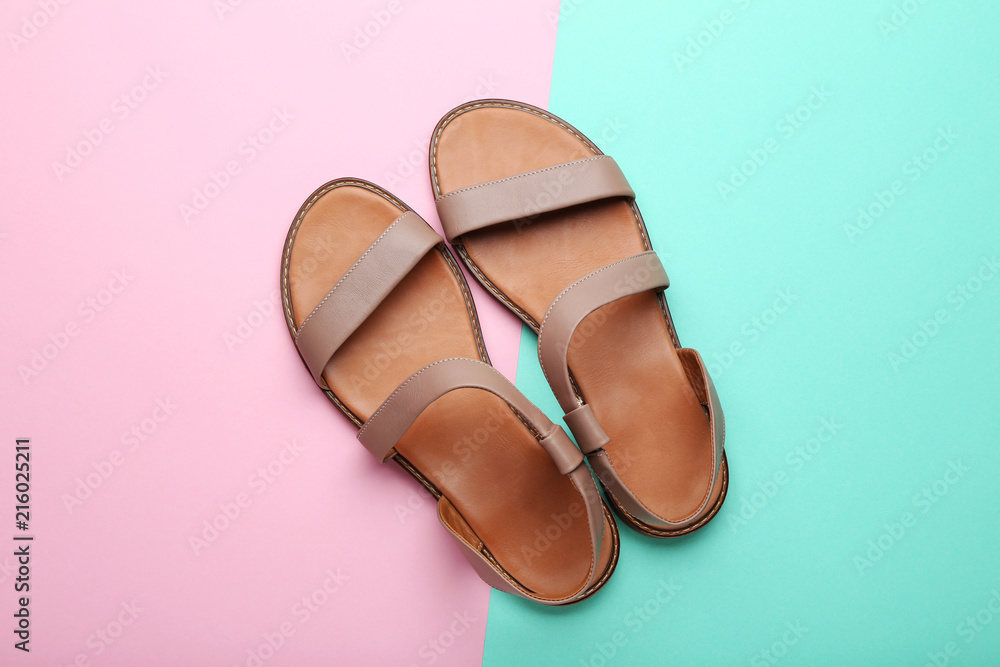Ταπετσαρία Female beige sandals on colorful background