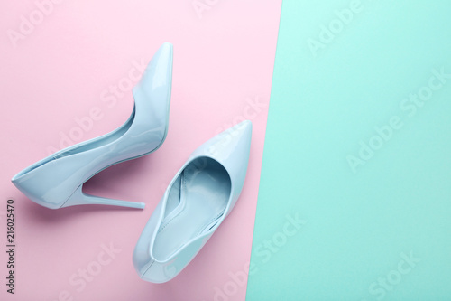 Blue high heel shoes on colorful background