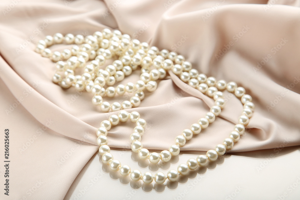 Pearl necklace with beige satin fabric