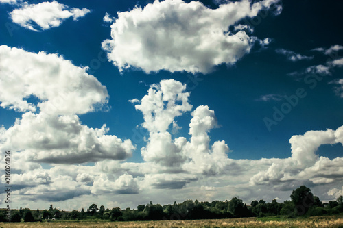 amazing clouds on blue sky and country side, beautiful summer nature landscape