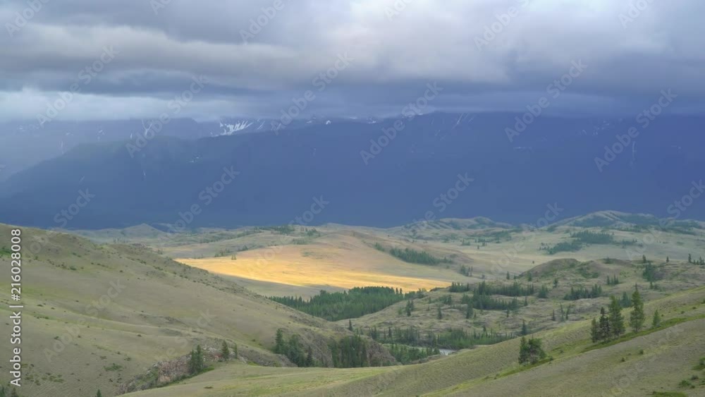 Mountain landscape. Snow-covered peak in the fog and clouds. The greatness of nature Mountain landscape. Snow-covered peak in the fog and clouds. The greatness of nature