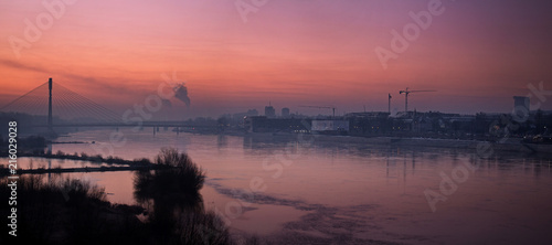 Panorama of Warsaw with the Swietokrzyski bridge in the morning fog of a smoky city