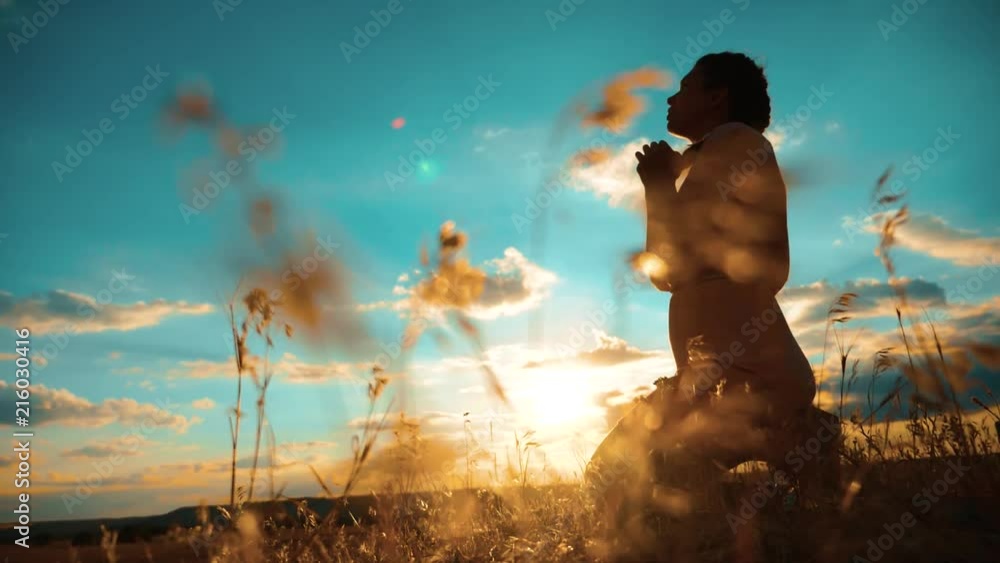 girl praying. girl folded her hands in lifestyle prayer silhouette at ...