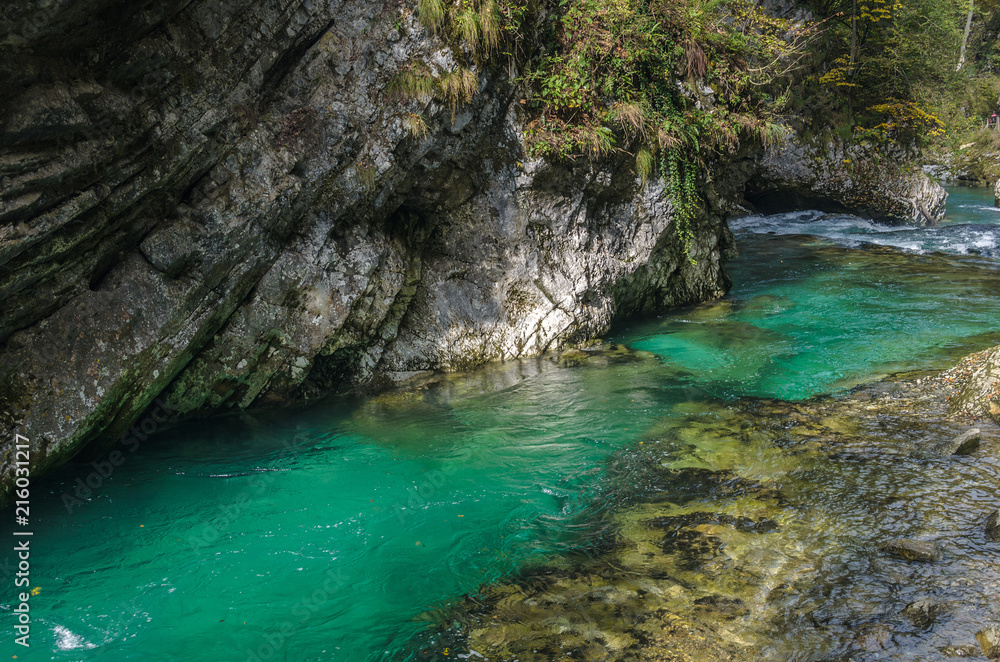 Nature autumn landscape. Waterfall at Soteska Vintgar Slovenia. The Vintgar Gorge or Bled Gorge. Nature autumn landscape. Waterfall at Soteska Vintgar Slovenia. The Vintgar Gorge or Bled Gorge.