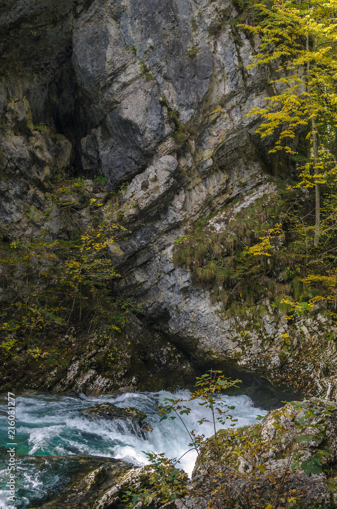 Nature autumn landscape. Waterfall at Soteska Vintgar Slovenia. The Vintgar Gorge or Bled Gorge. Nature autumn landscape. Waterfall at Soteska Vintgar Slovenia. The Vintgar Gorge or Bled Gorge.