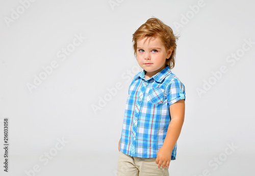 Portrait of a charming boy in a shirt