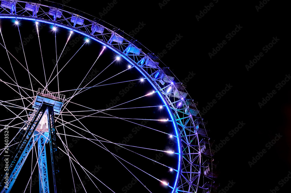 Big ferris wheel with festive blue illumination