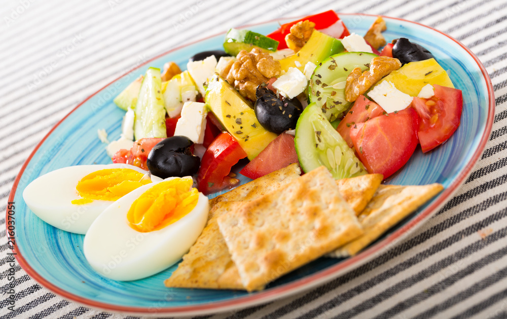 Vitamin salad with boiled egg and crackers