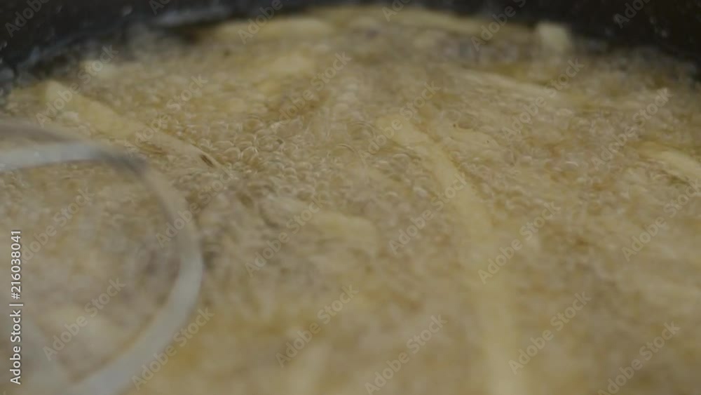 French Fries Being Cooked In Fresh Oil French Fries Being Cooked In Fresh Oil