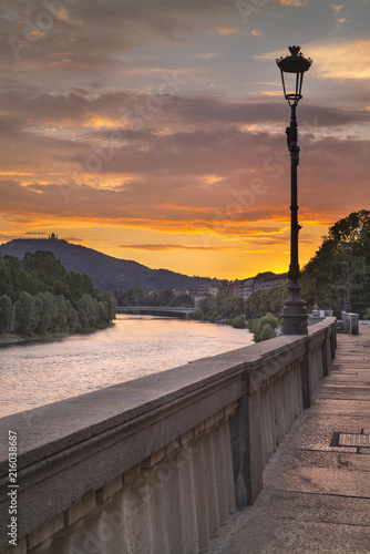river side and street lighter in beautiful sunset time in Turin in Italy © sergejson