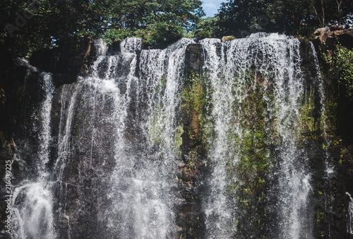 Llanos de Cortez waterfall in Bagaces, Costa Rica with heavy flow during rainy season photo