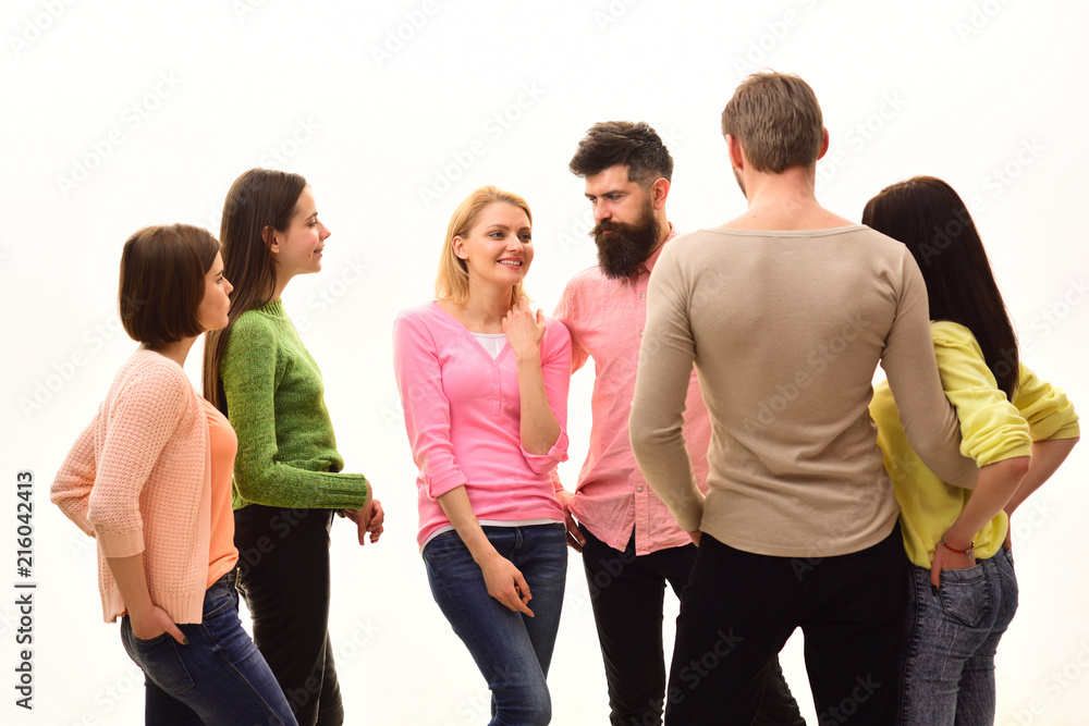Obraz premium Communication concept. Students, happy friends, couples have fun, white background, isolated. Youth, friends and couples speaking. Young people spend leisure together, cheerful company hangs out
