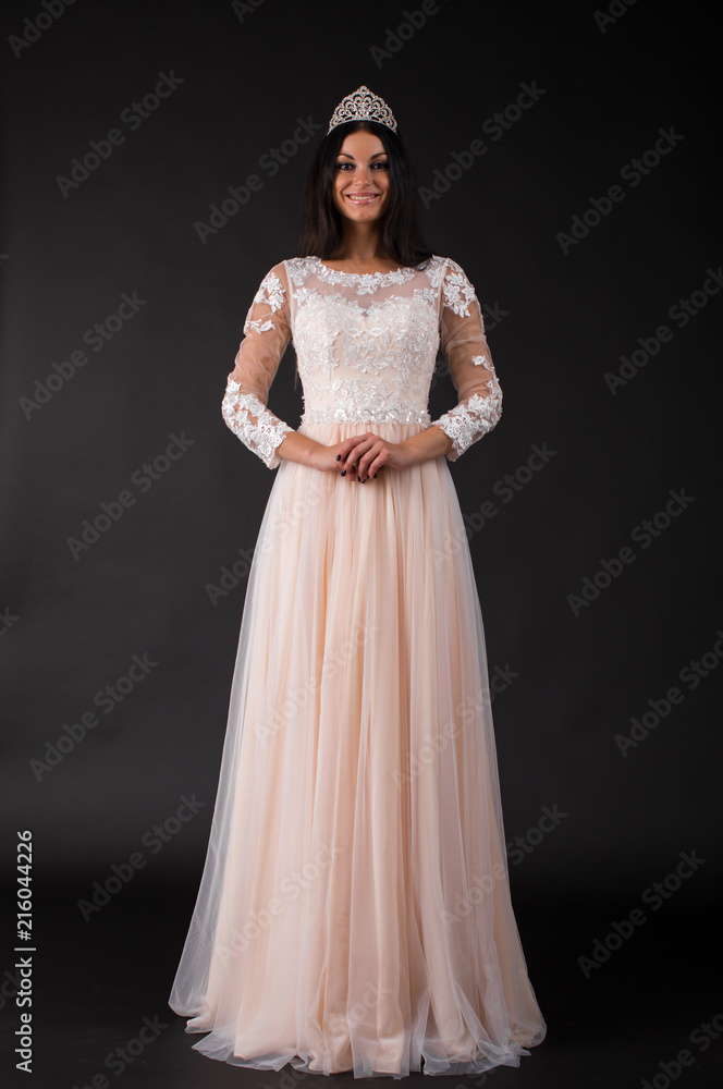  Full length of a beautiful bruenette woman in wedding dress