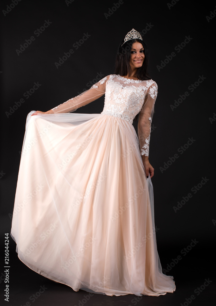 Full length of a beautiful bruenette woman in wedding dress Full length of a beautiful bruenette woman in wedding dress