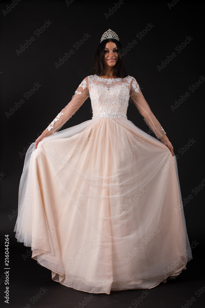  Full length of a beautiful bruenette woman in wedding dress