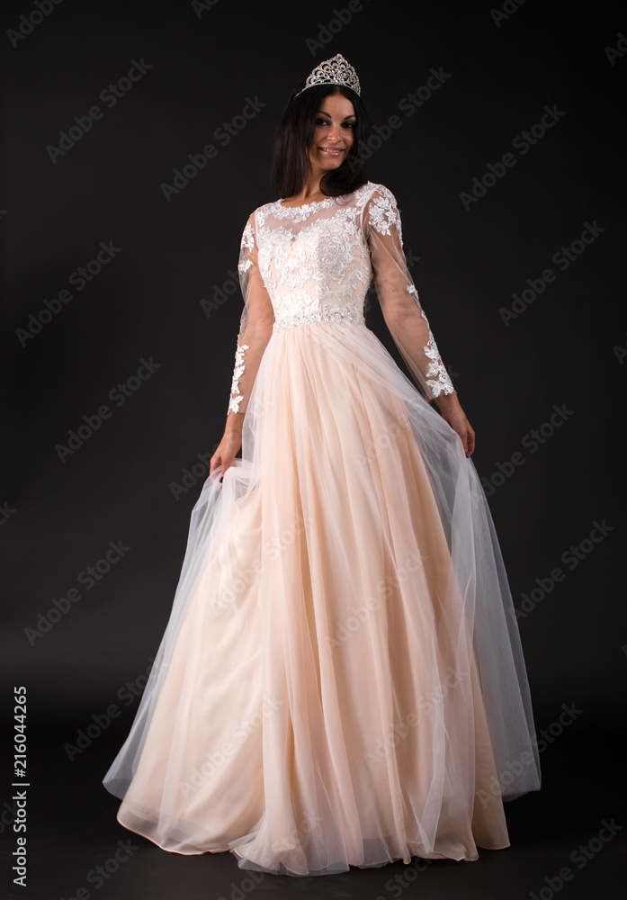  Full length of a beautiful bruenette woman in wedding dress