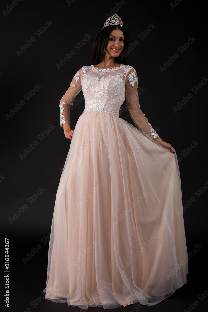 Full length of a beautiful bruenette woman in wedding dress Full length of a beautiful bruenette woman in wedding dress
