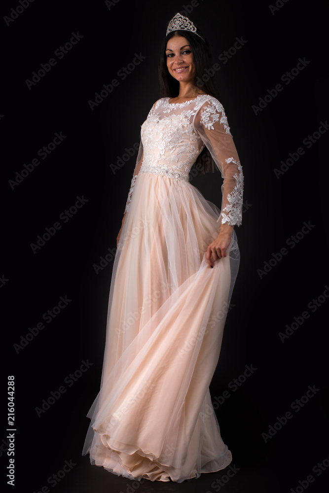 Full length of a beautiful bruenette woman in wedding dress Full length of a beautiful bruenette woman in wedding dress