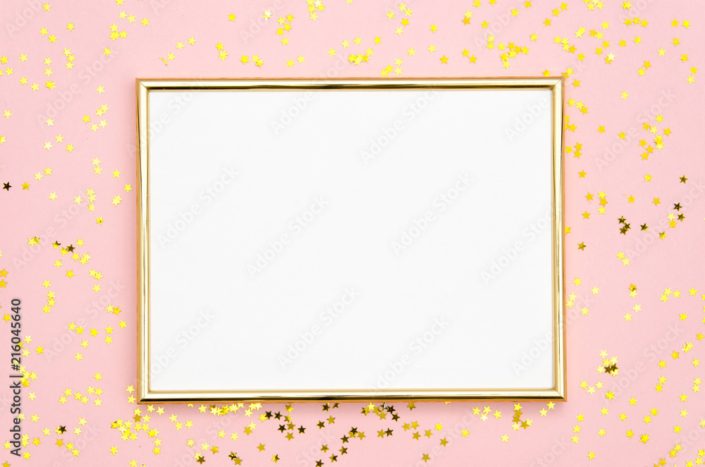 Photo frame mock up with space for text, golden sequins confetti on pink background. Lay Flat, top view. Valentine's minimal flatly background.