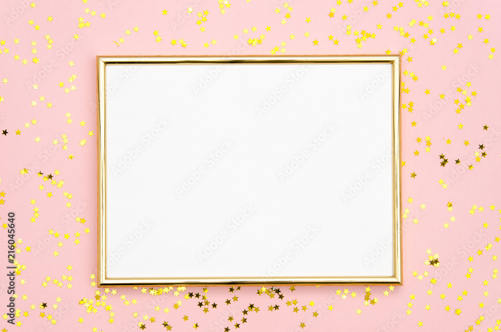 Photo frame mock up with space for text, golden sequins confetti on pink background. Lay Flat, top view. Valentine's minimal flatly background. Photo frame mock up with space for text, golden sequins confetti on pink background. Lay Flat, top view. Valentine's minimal flatly background.