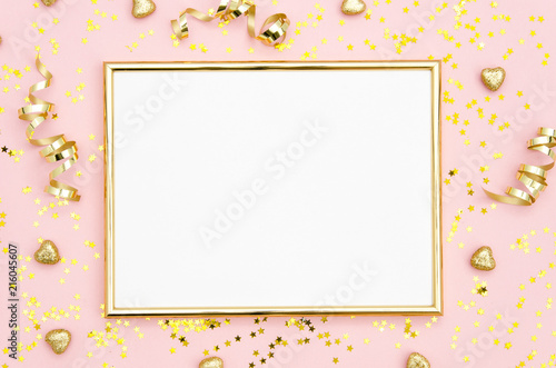 Photo frame mock up with space for text, golden sequins confetti on pink background. Lay Flat, top view. Valentine's minimal flatly background.
