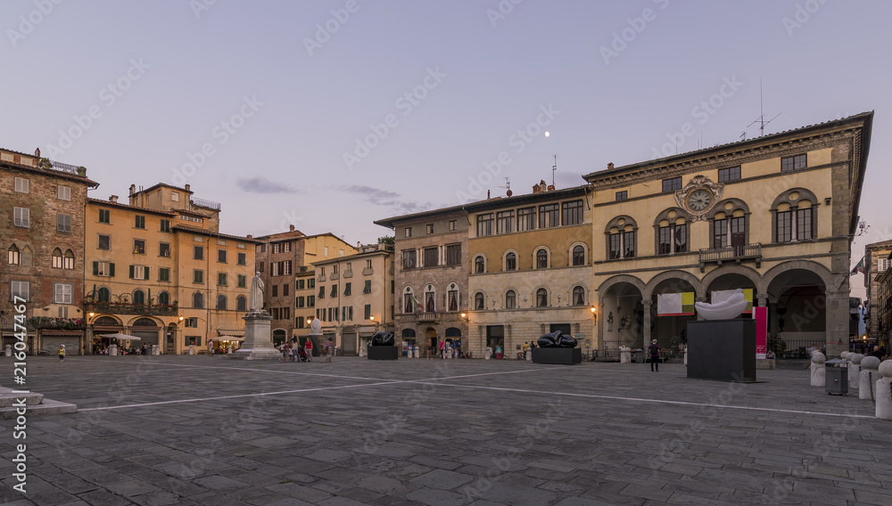 Beautiful view of Piazza San Michele at blue hour, with the moon in the sky, Lucca, Tuscany, Italy, Europe