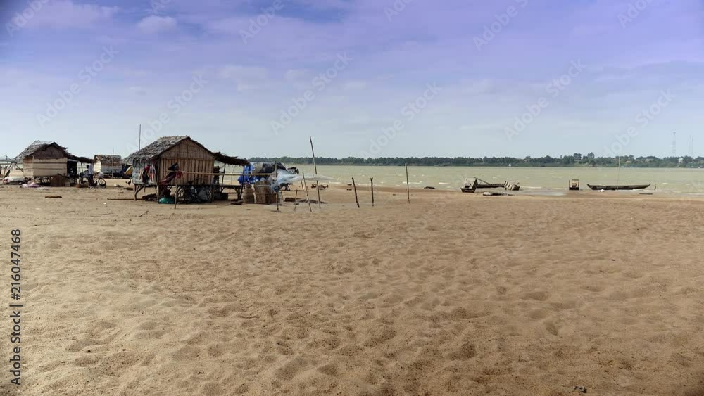 Small fishing village on the riverside on a windy day Small fishing village on the riverside on a windy day