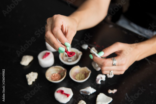 The process of wax casting and moulding silver jewellery with natural objects like seashells with jeweller's wax