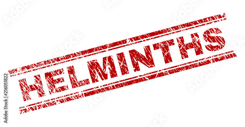 HELMINTHS seal print with corroded texture. Red vector rubber print of HELMINTHS text with retro texture. Text title is placed between double parallel lines.