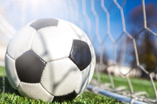 Soccer ball in goal, sport concept