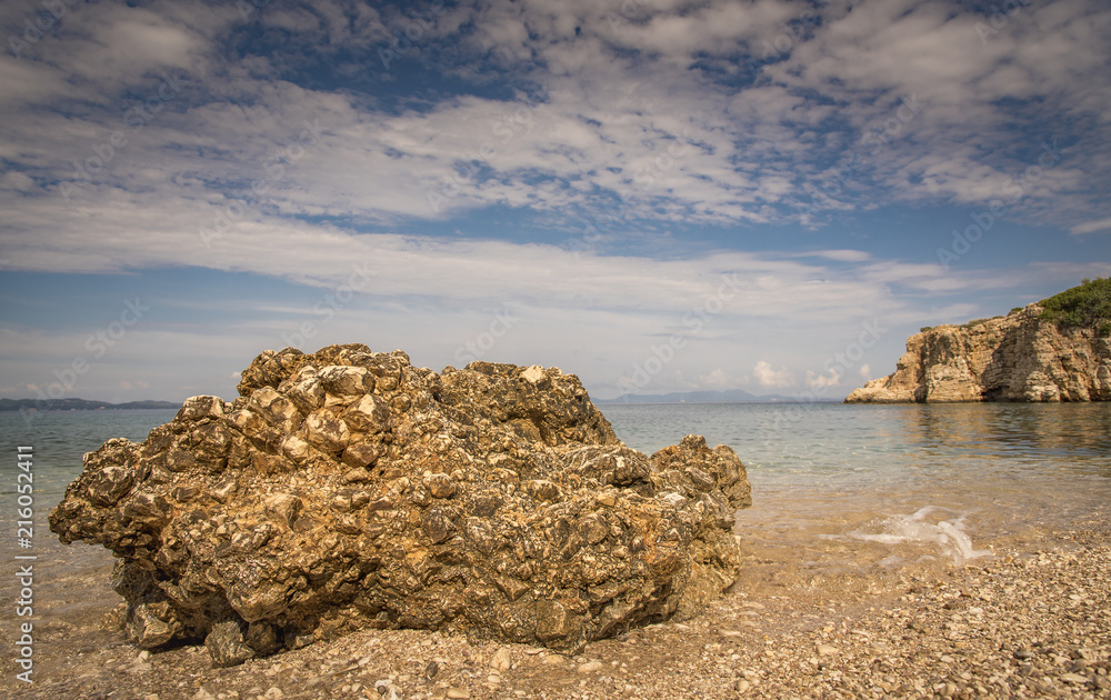 Far reach of Dei beach in Syvota, Greece, rocky beach and clear Ionian sea