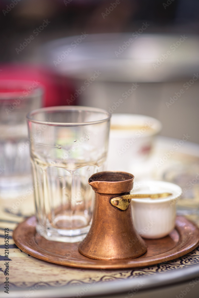Fotka „Sarajevo, capital of Bosnia. Traditional handcrafted copper plated  coffee filled with traditional foam Bosnian coffee served in an ornament  Sarajevo set“ ze služby Stock | Adobe Stock