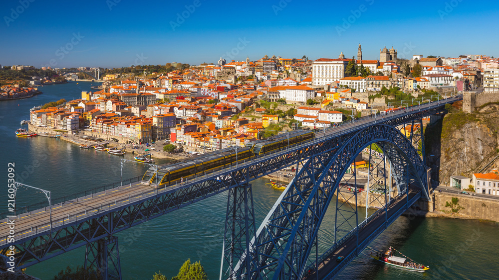 Obraz premium Panoramic view of Old city of Porto (Oporto) and Ribeira over Douro river, Portugal. Concept of world travel, sightseeing and tourism.