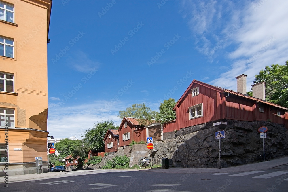 Old red wood homes in hills of Sodermalm