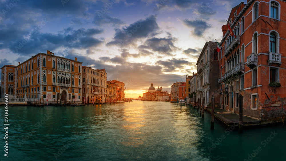 Sunrise in Venice. Image of Grand Canal in Venice, with Santa Maria della Salute Basilica in the background. Venice is a popular tourist destination of Europe. Venice, Italy.