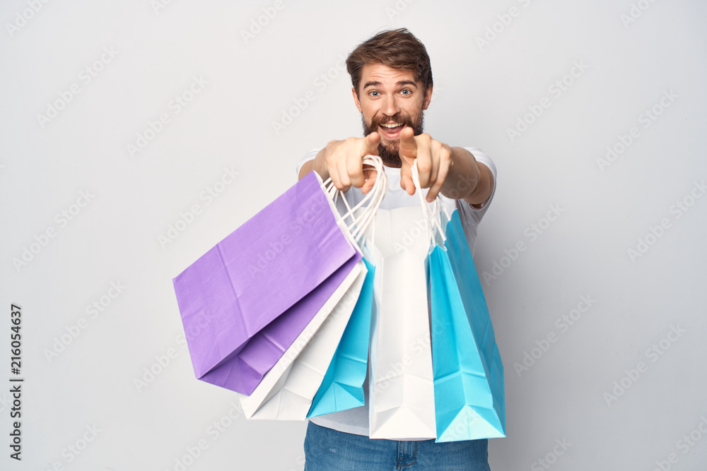 joyful man with shopping bags joyful man with shopping bags