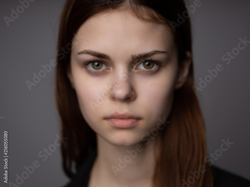serious woman without makeup portrait