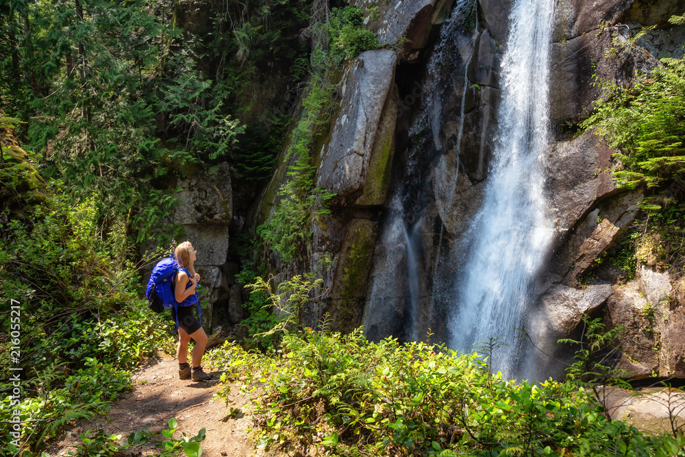 Adventurous woman is hiking in beautiful Canadian Nature during a sunny summer day. Taken in Squamish, North of Vancouver, BC, Canada. Adventurous woman is hiking in beautiful Canadian Nature during a sunny summer day. Taken in Squamish, North of Vancouver, BC, Canada.