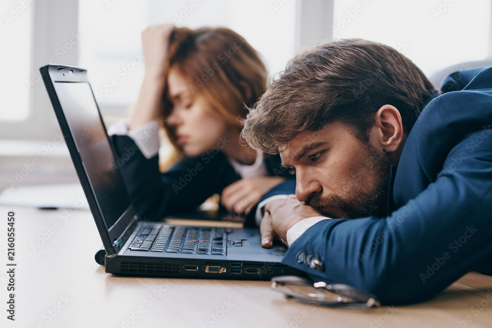 business colleagues sleeping in the office laptop business colleagues sleeping in the office laptop