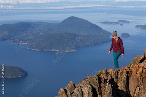 Adventurous woman hiking in the mountains during a sunny summer day. Taken on Mount Brunswick, Lions Bay, North of Vancouver, BC, Canada. © edb3_16