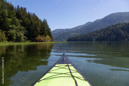 Kayaking in Harrison River during a beautiful and vibrant summer day. Located East of Vancouver, British Columbia, Canada.