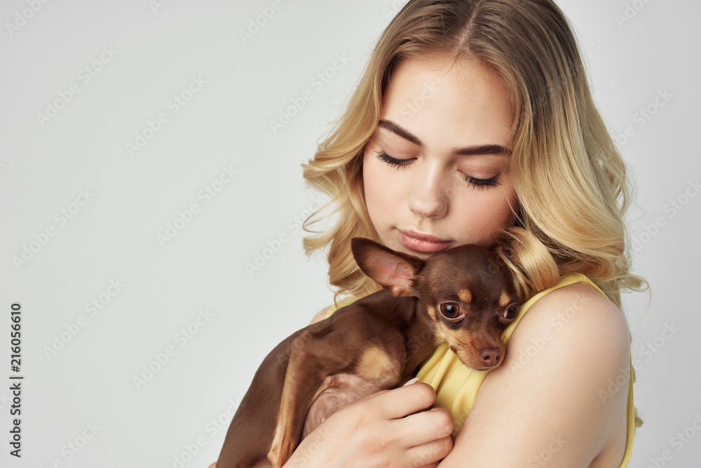 woman with a dog in her arms