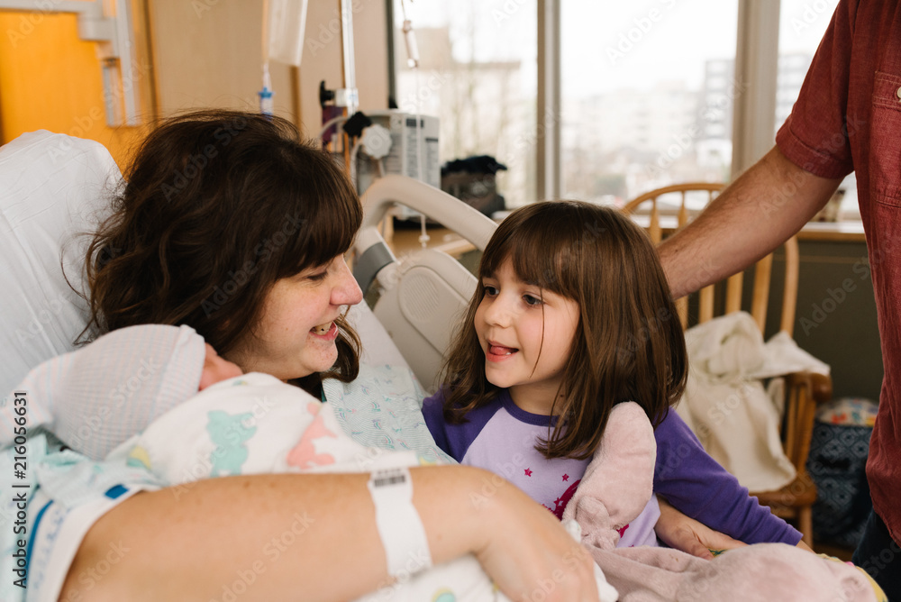 Mother with daughter and newborn Mother with daughter and newborn