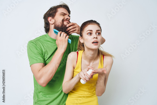 man combing his beard woman surprised