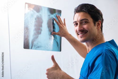 Young handsome doctor radiologyst working in hospital 