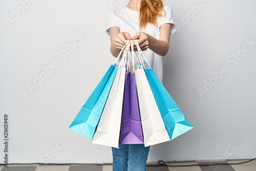 girl holds in her hand packages from the store