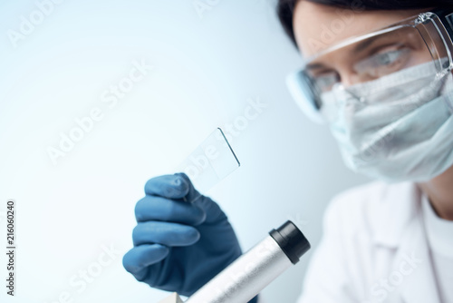 female lab technician conducts experiments