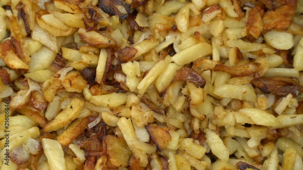 Fried potatoes in a frying pan rotate Fried potatoes in a frying pan rotate