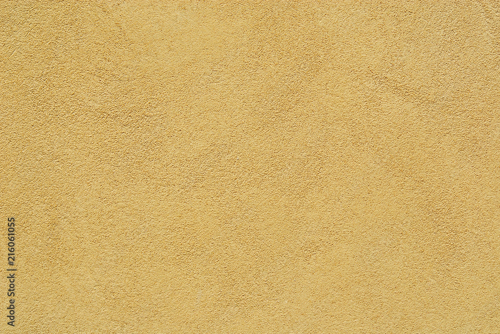 Yellow brownish plaster on wall as background Yellow brownish plaster on wall as background